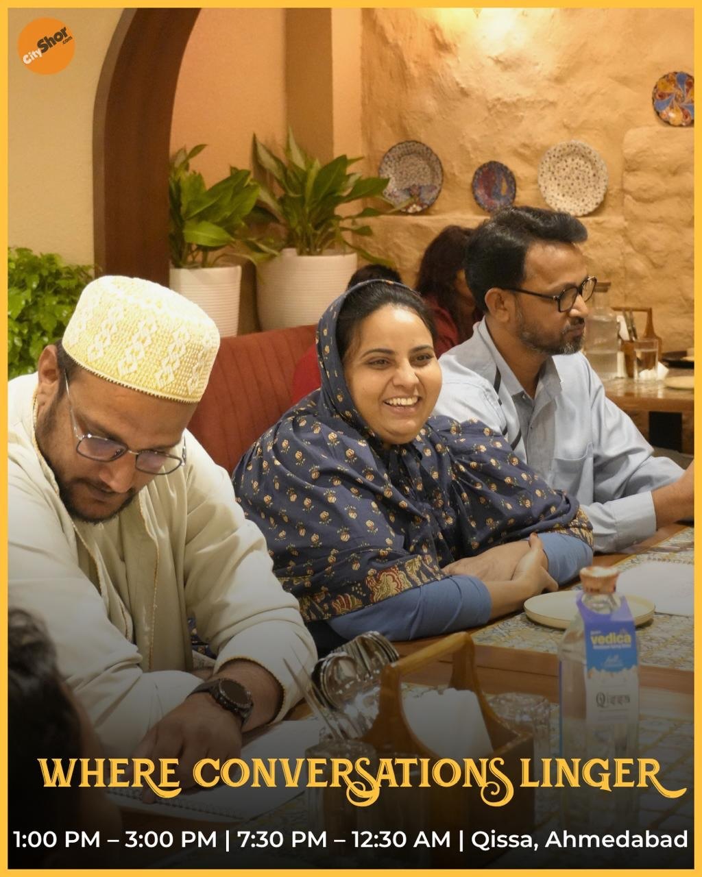 Friends laughing together at Qissa