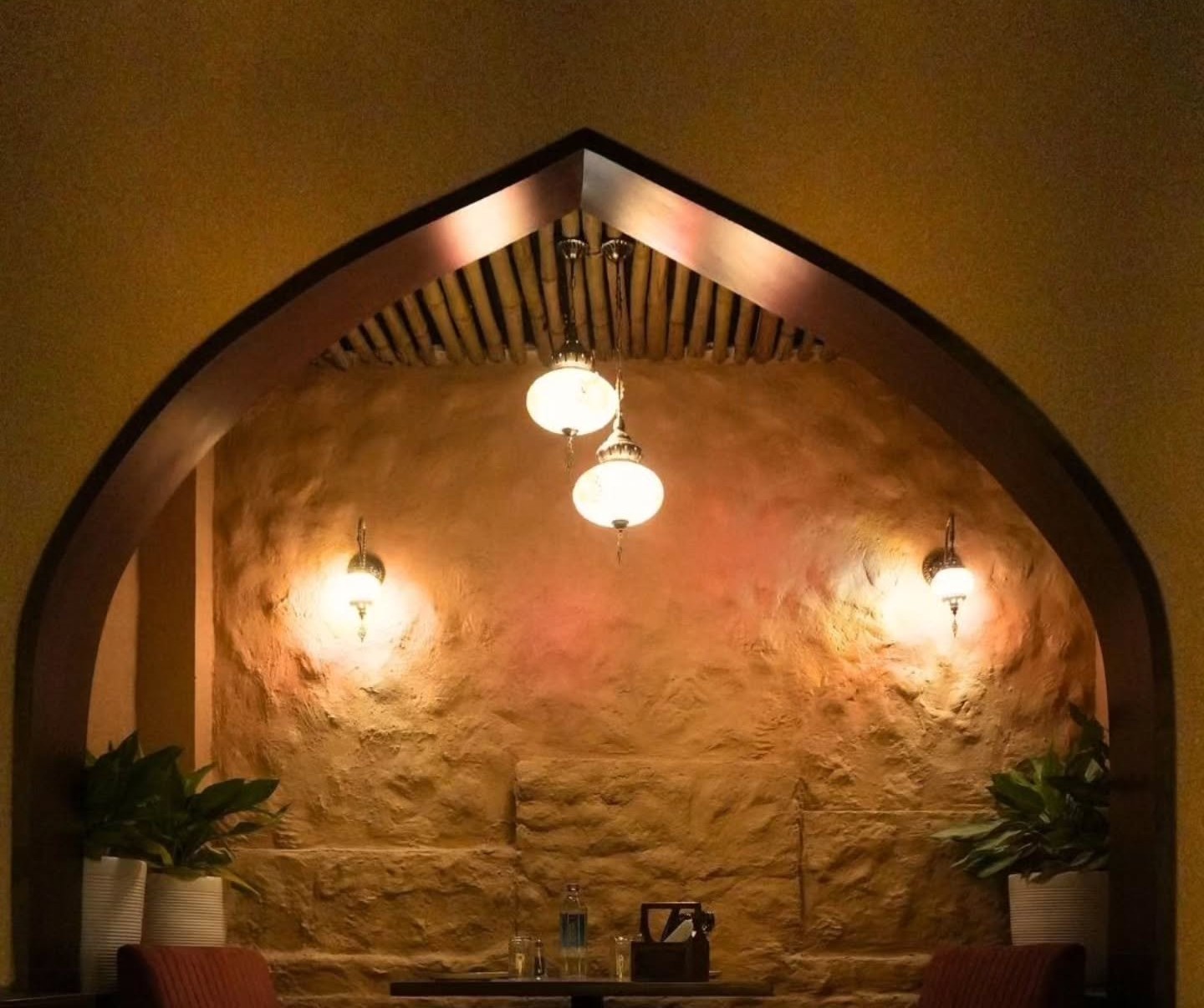 Private arched booth with Arabic ambience