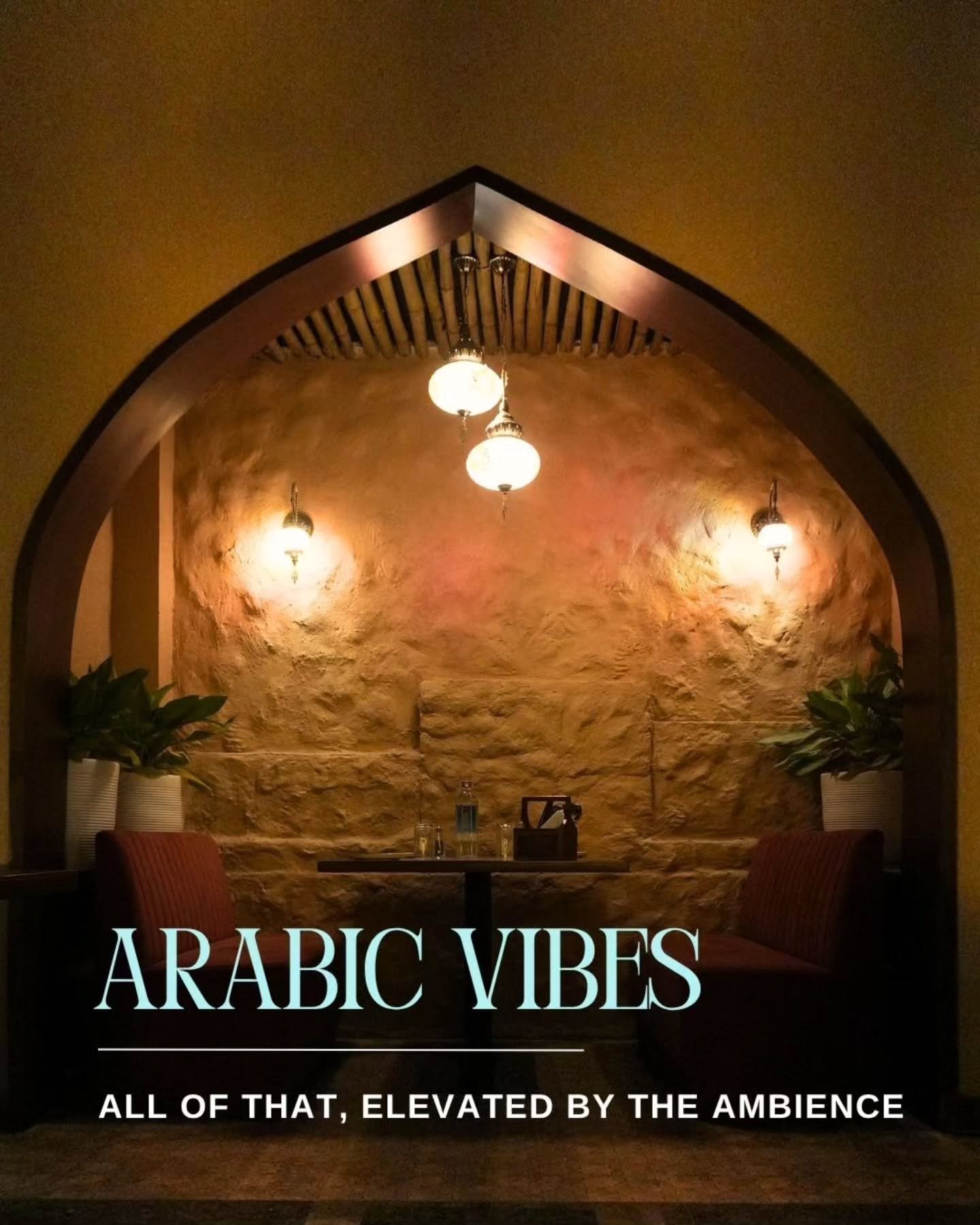 Private arched booth with warm lantern light at Qissa