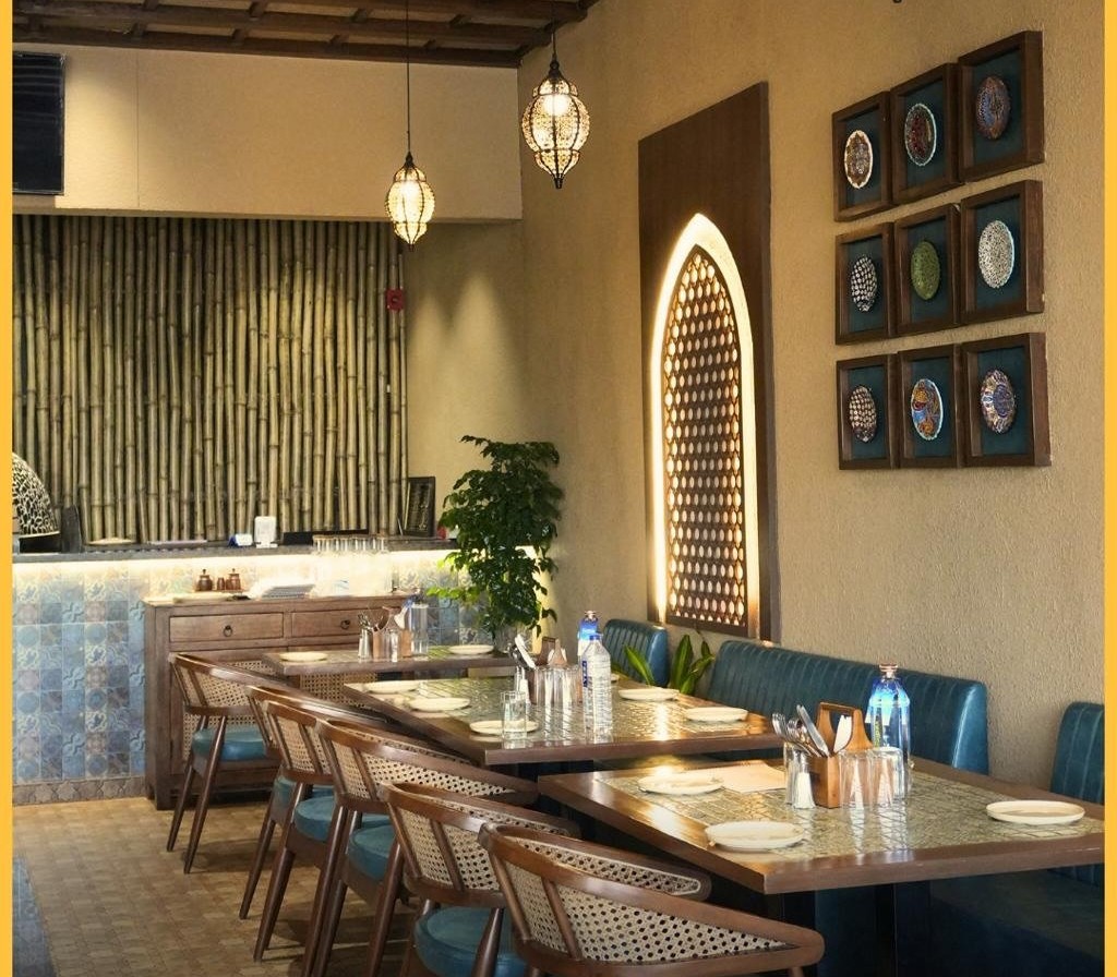 Booth seating and arched lattice lighting